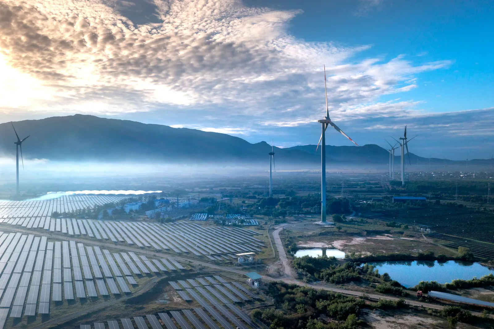 Wind turbines and solar panels in the Polish countryside
